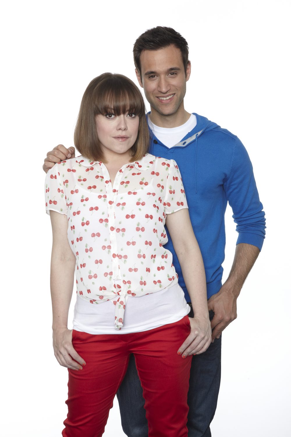 Gennie and Nikhil in Emmerdale pose looking happy and serious