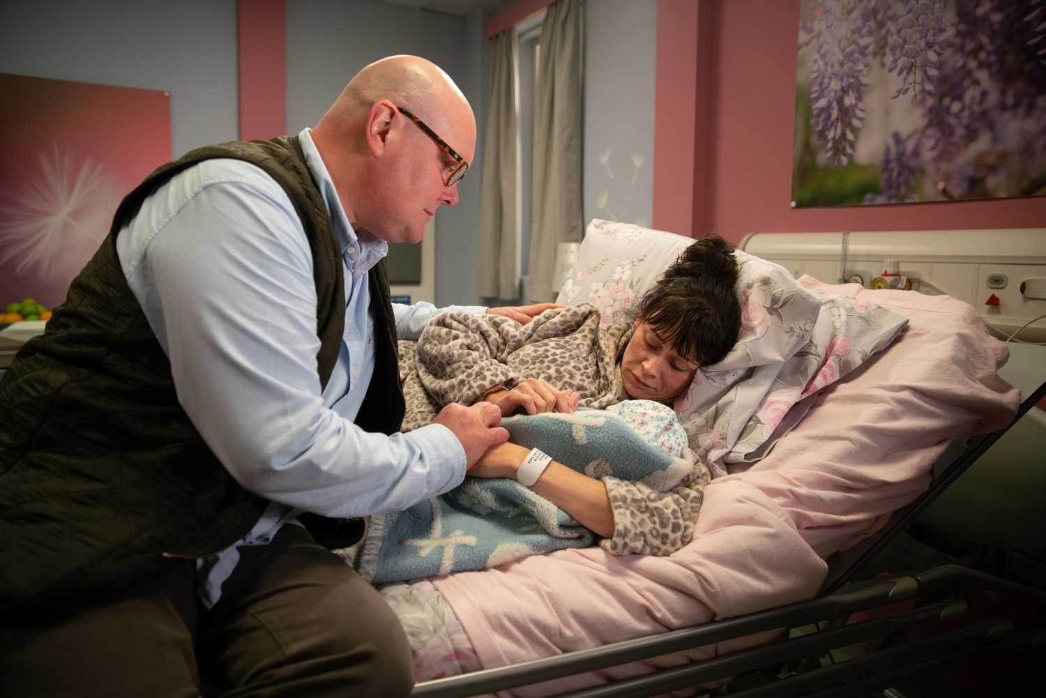 Paddy and Chas in hospital cuddling baby Grace just before she dies