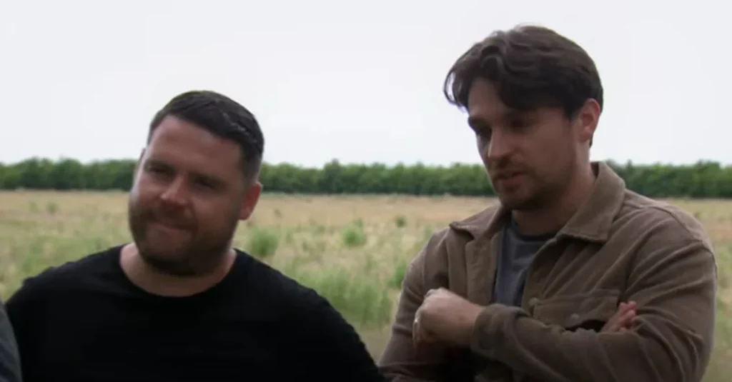 Emmerdale's Mack and Aaron are laughing together outside