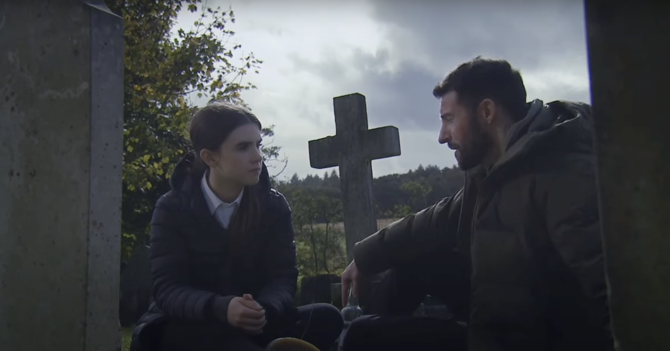 Ross and April sit in the graveyard in Emmerdale