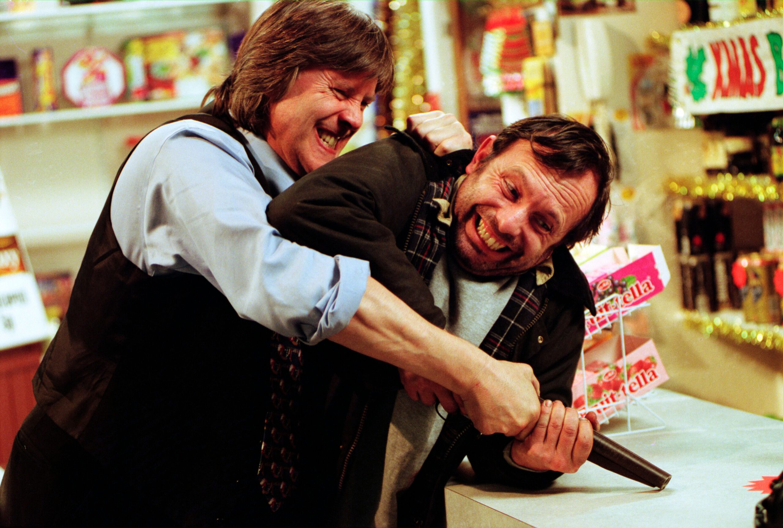 Billy and Vic fight for the gun in Emmerdale