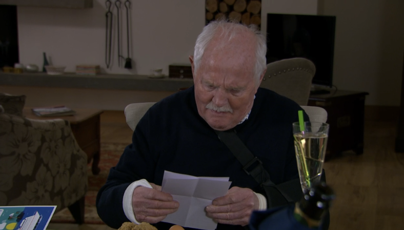 Eric Pollard reading a letter in Emmerdale