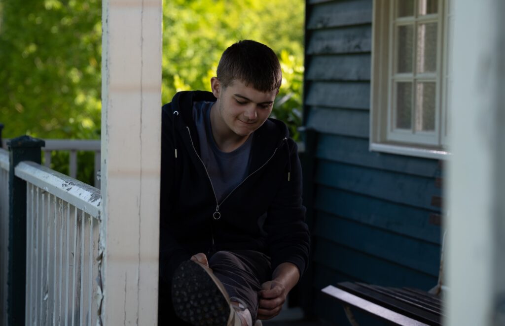 Dylan looks at his injury in Emmerdale