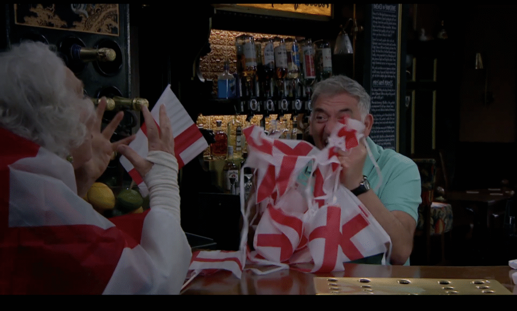 Mary and Bob celebrated with flags and roaring (Credit: ITV)