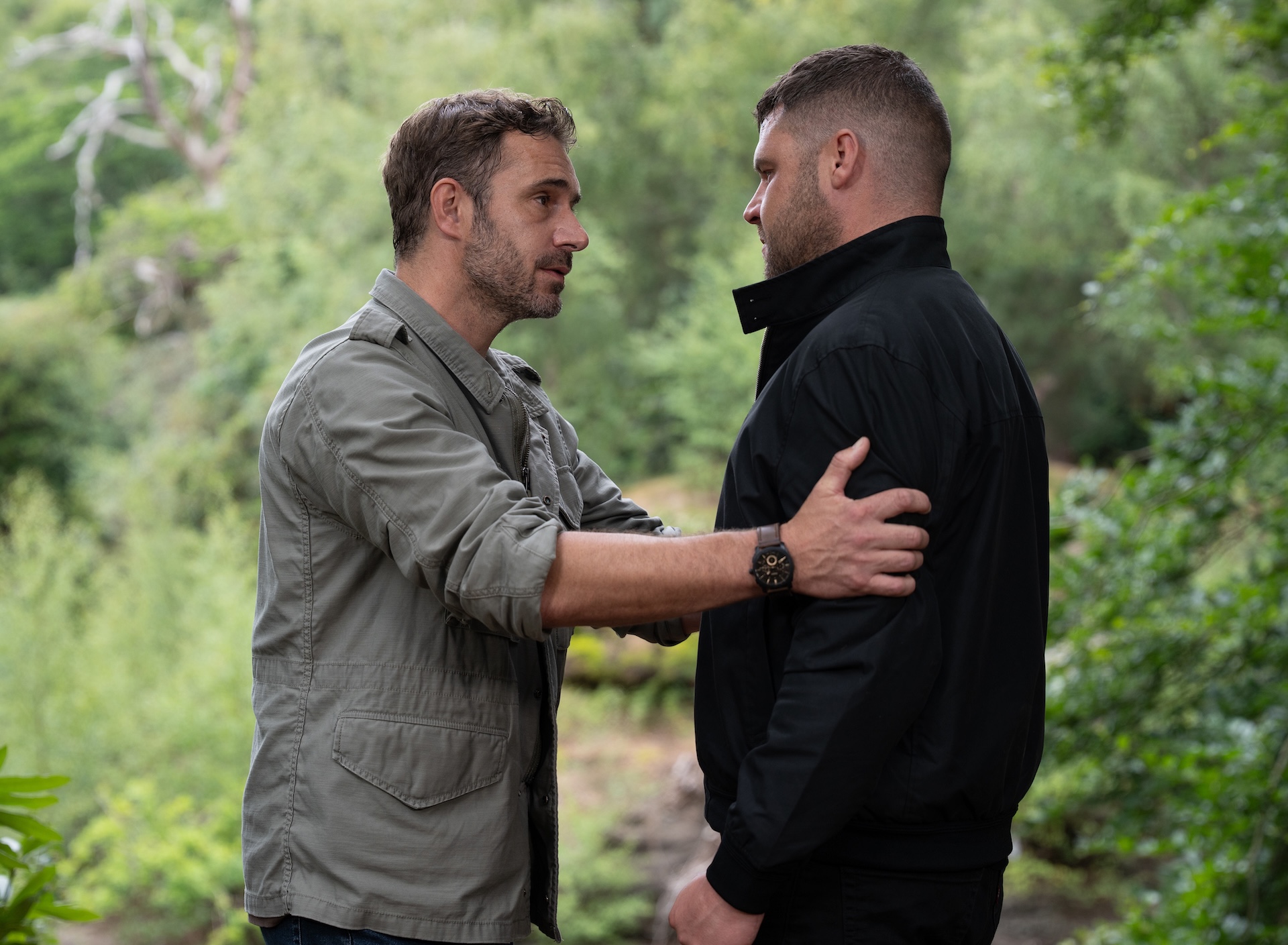 John holds Aaron's arms