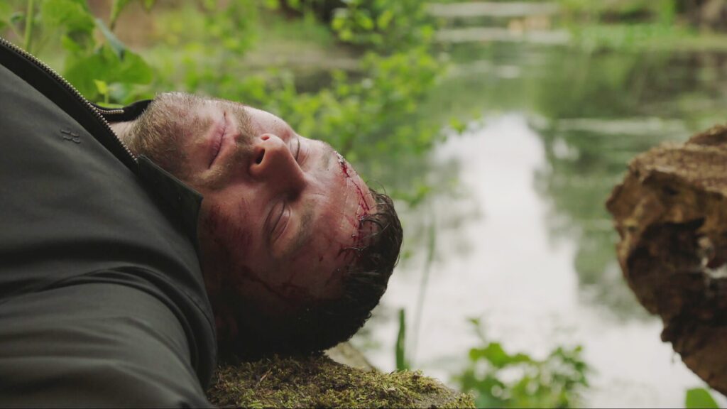 Aaron lies at the bottom of the gorge in Emmerdale