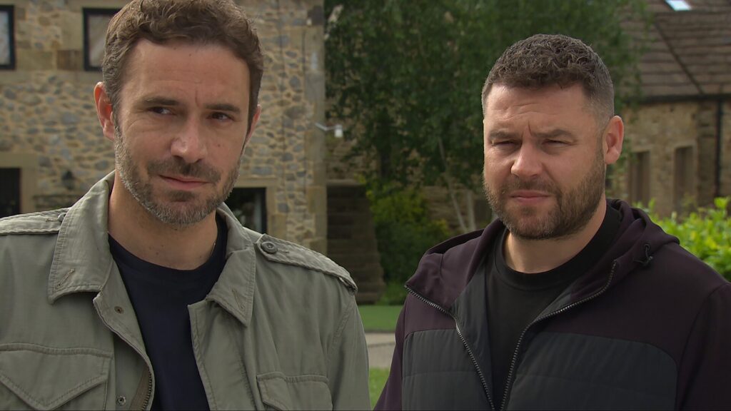 Aaron looks anxious standing next to John