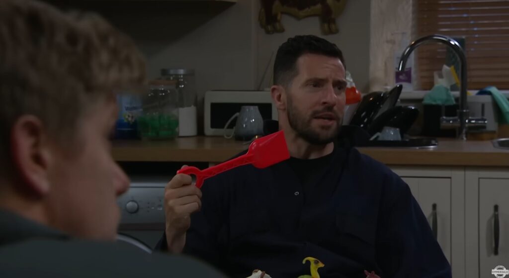 Ross holds hid red spade (Credit: ITV)