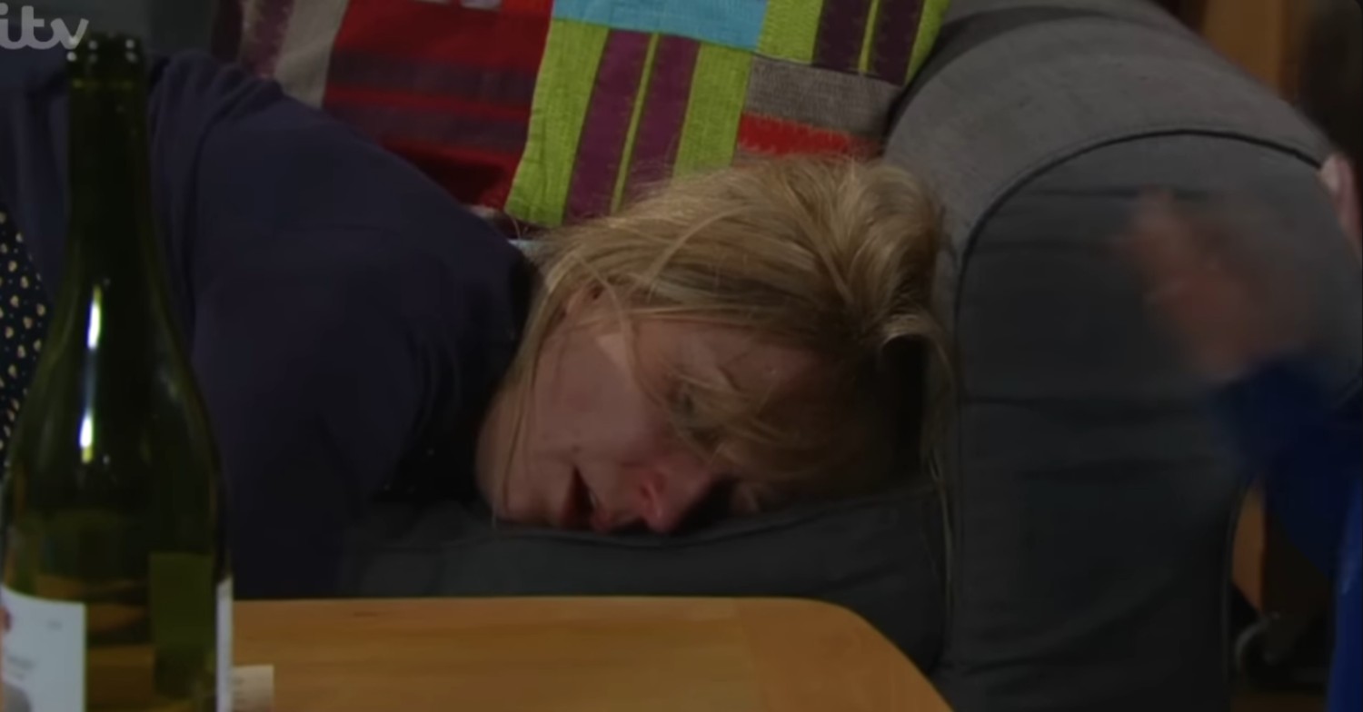 Laurel passed out on the sofa in Emmerdale