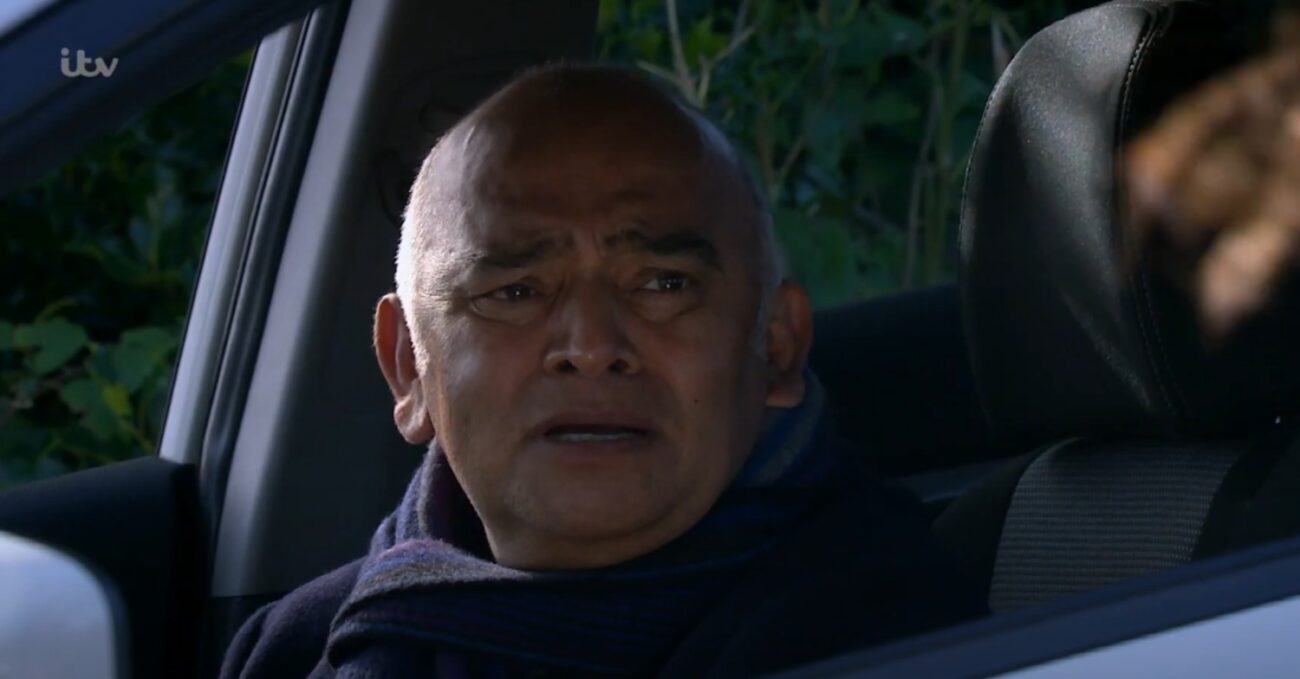 Rishi looks shocked and worried on Emmerdale