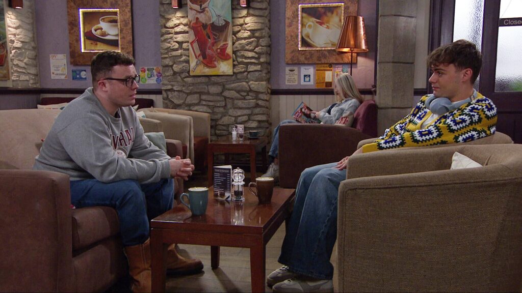 Lewis and Vinny chat in the cafe