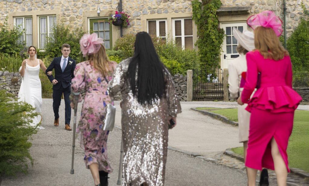 The wedding guests leave the church as Gabby approaches in Emmerdale