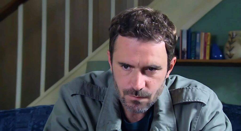 John Sugden looks serious in Emmerdale (Credit: ITV)