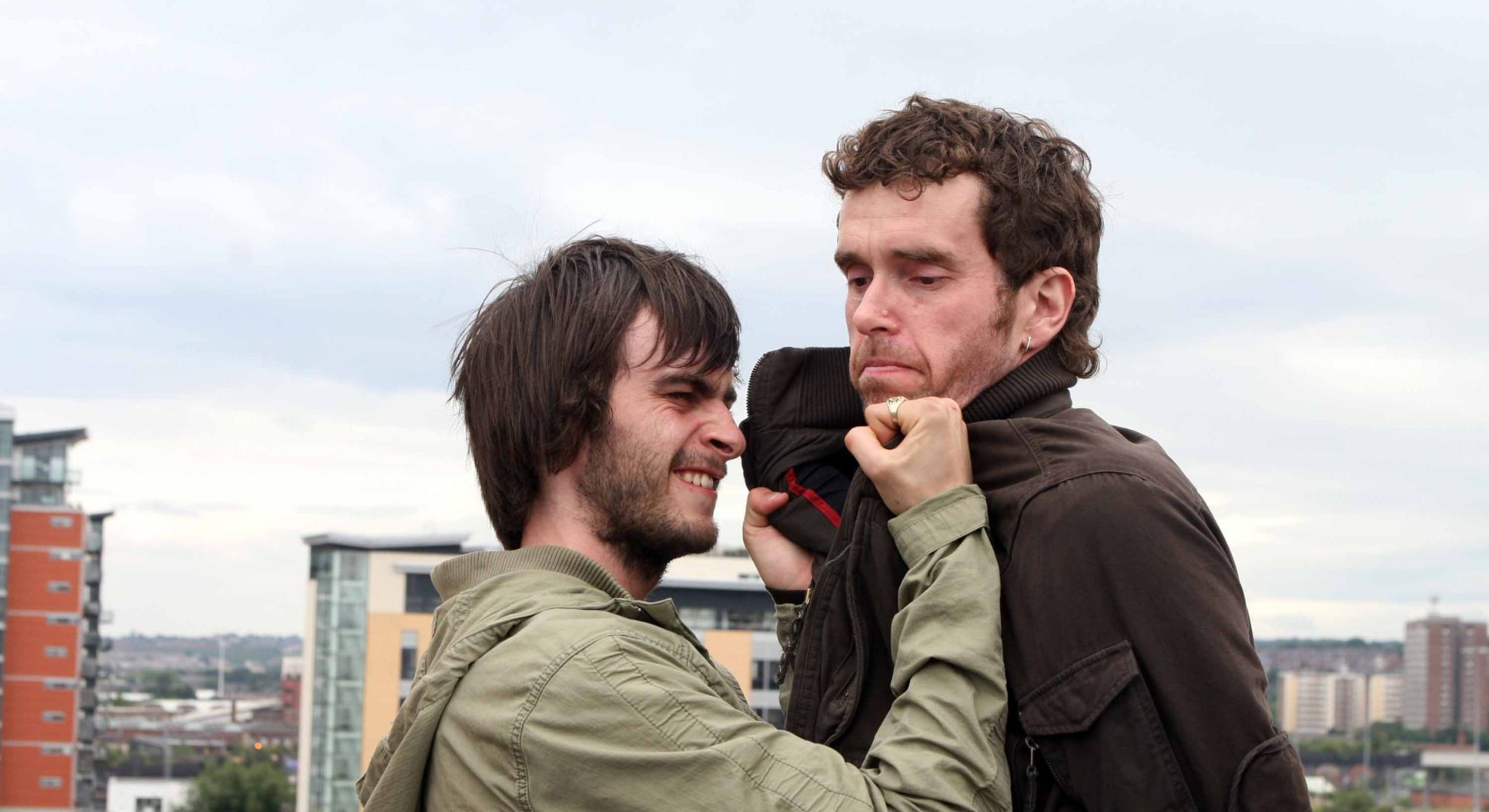 Eli and Marlon scuffle on the carpark roof