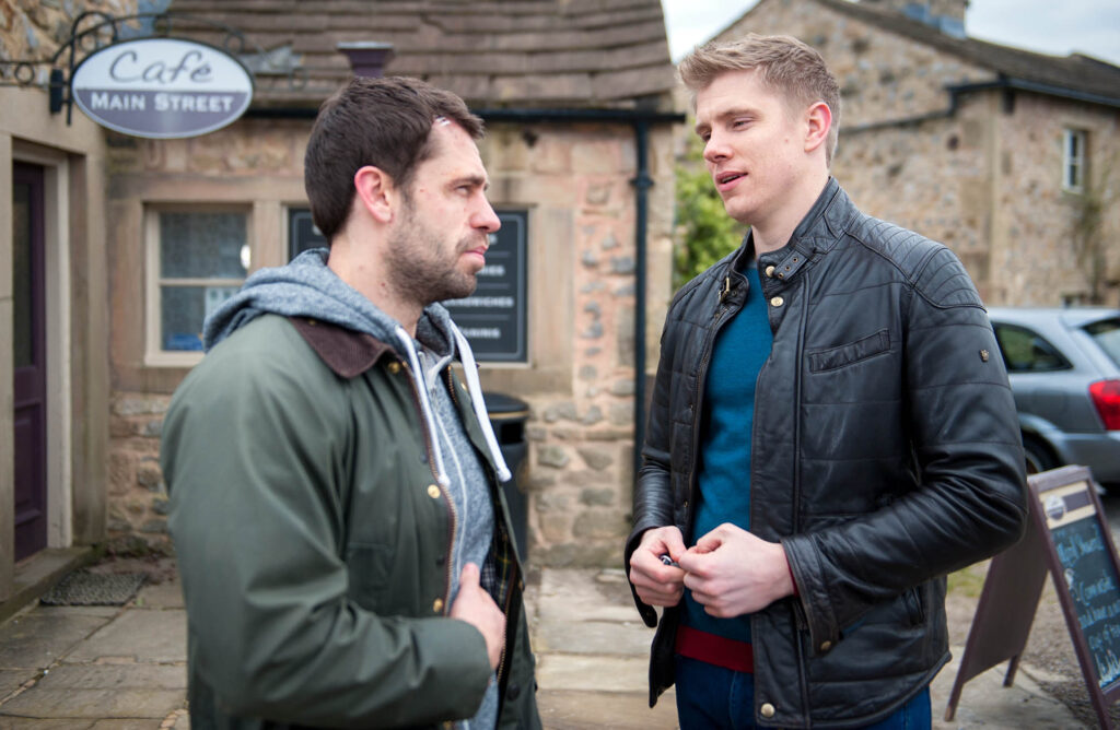 Andy Sugden and Robert Sugden chatting 