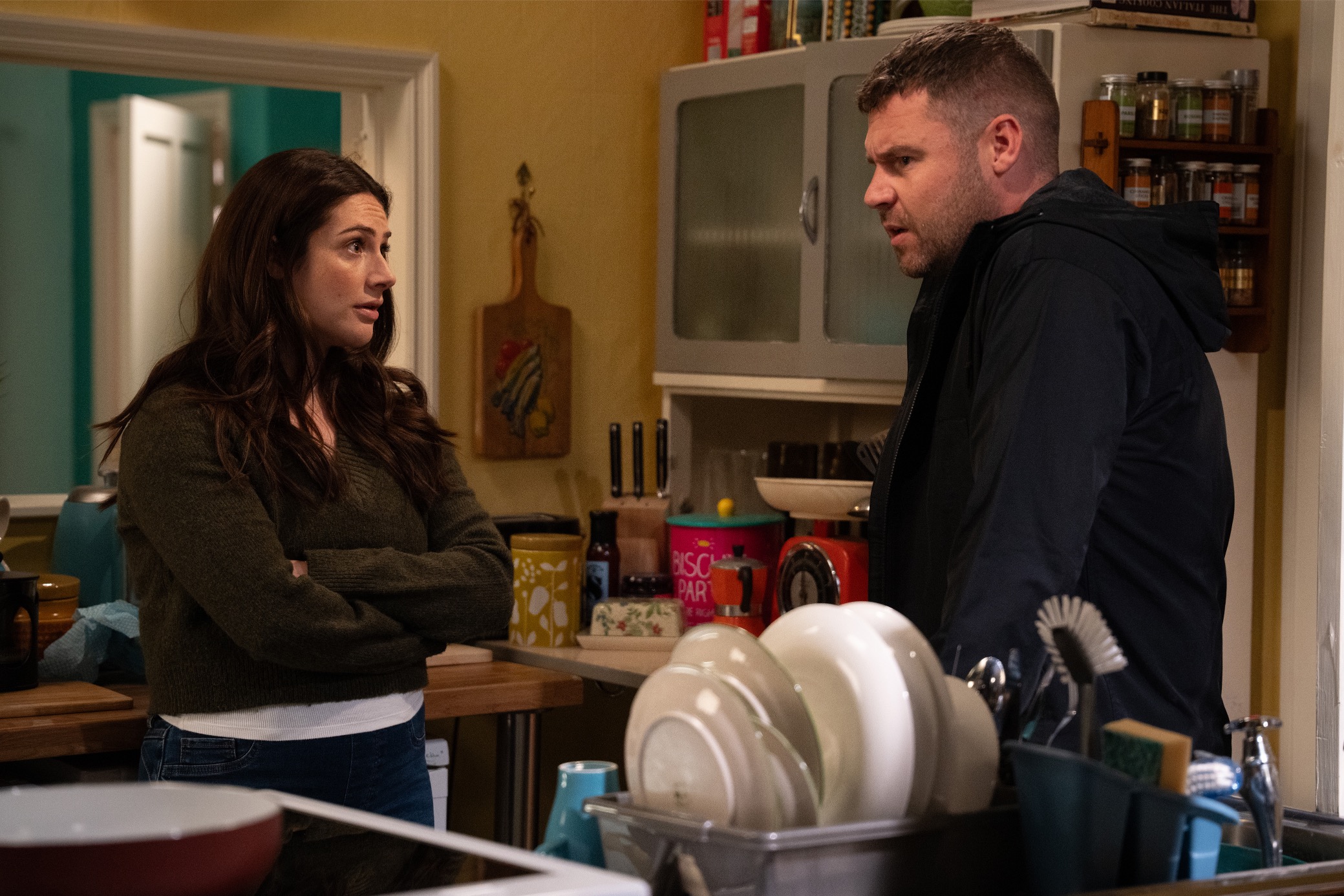 Aaron and Victoria talk in the kitchen at Keepers