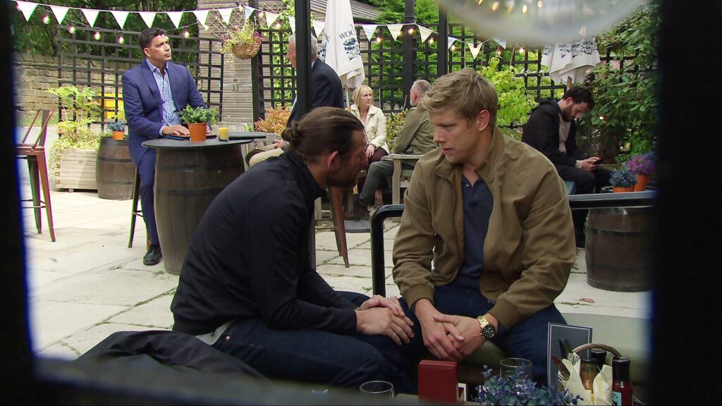 Kev and Robert are in an intimate moment when Aaron catches them (Credit: ITV)