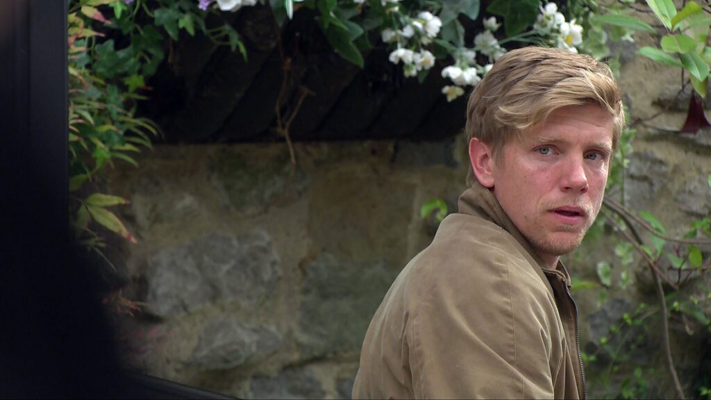 Robert looks shocked in Emmerdale
