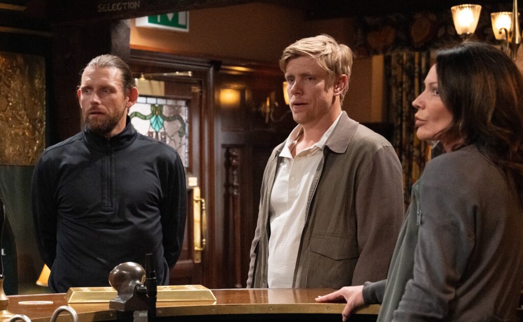 Kev and Robert stand at the bar in The Woolpack