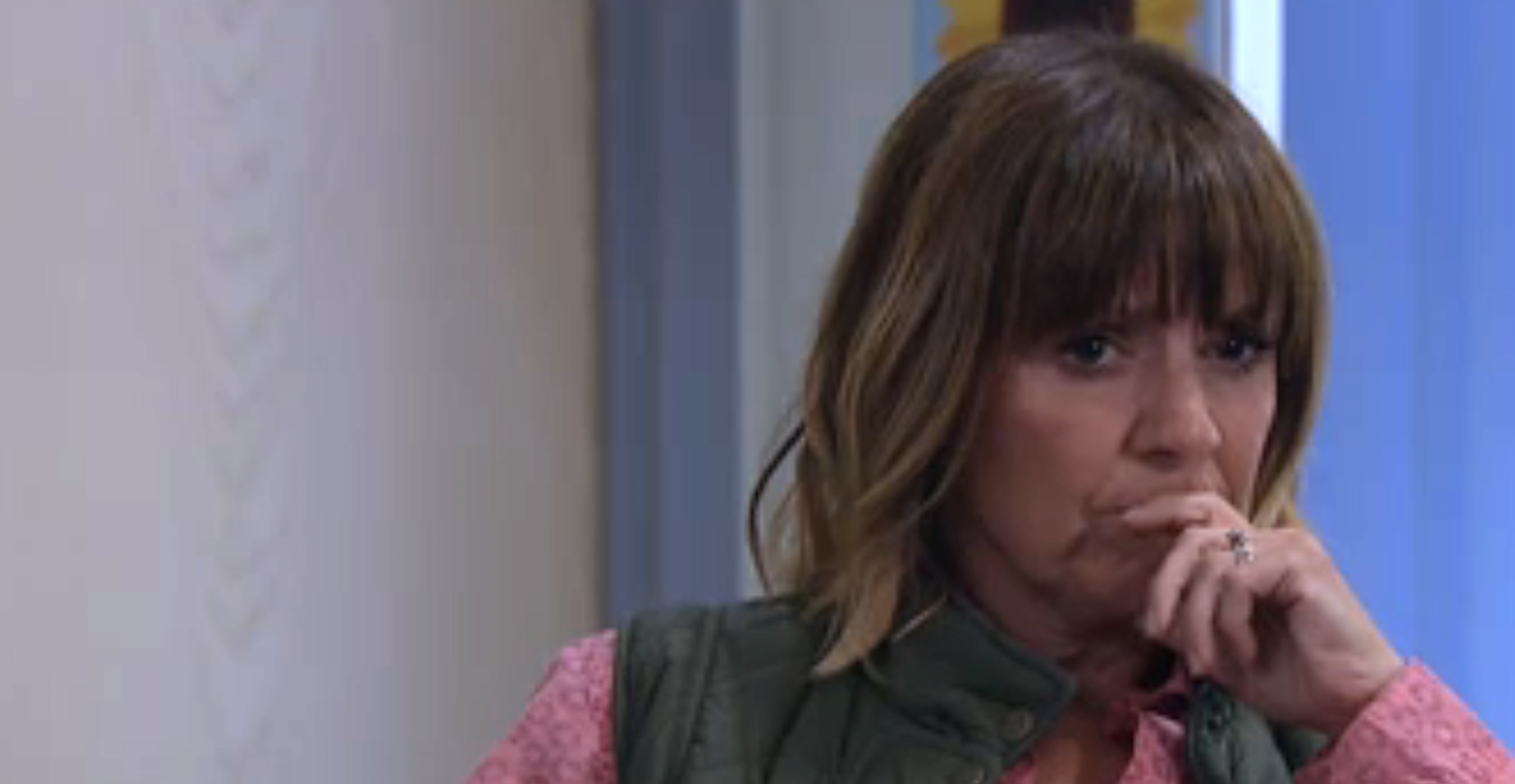Rhona looks suspicious