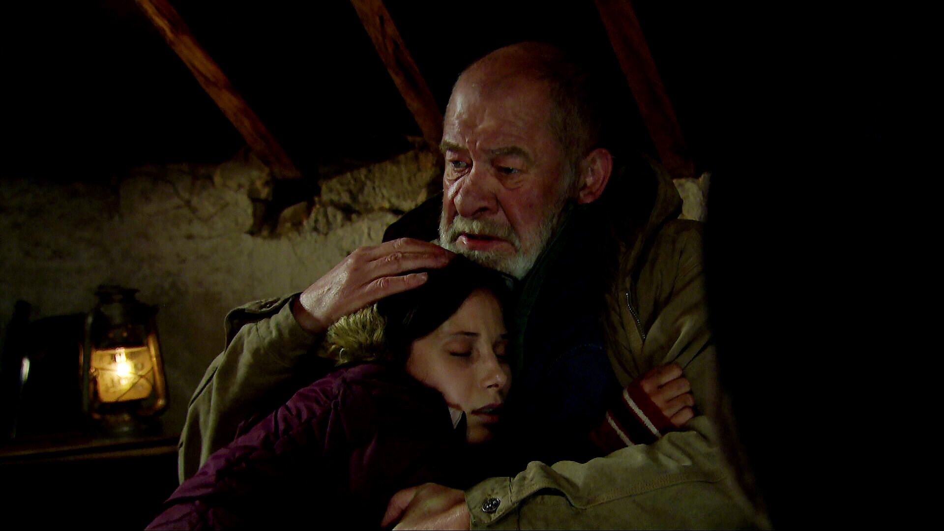 Bear comforts dying Anya in Emmerdale