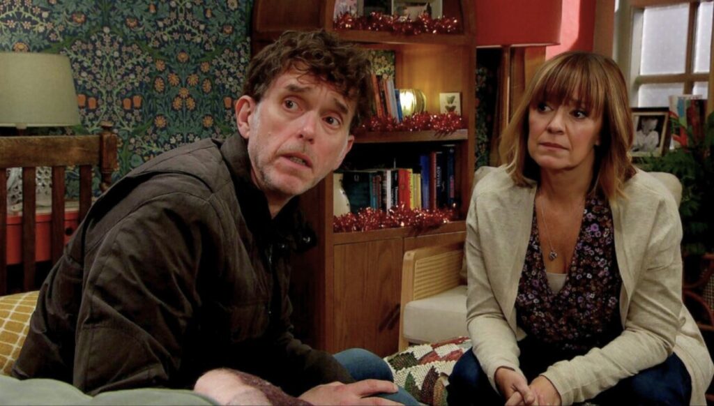 Marlon and Rhona are shocked in Emmerdale (Credit: ITV)