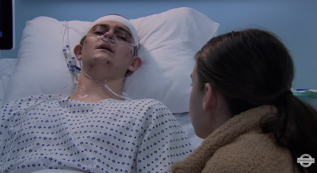 Dylan and April chat in the hospital