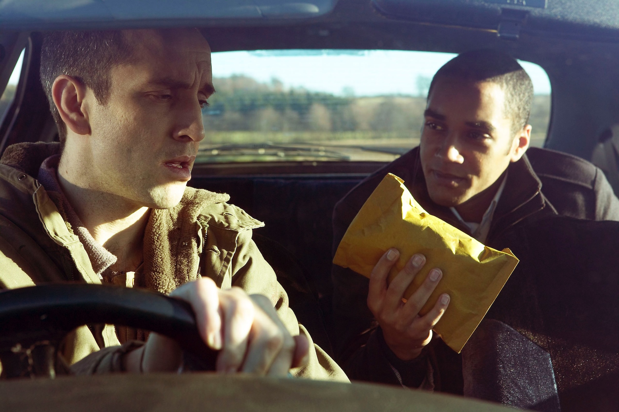 Ross finds a package in Sam's car 