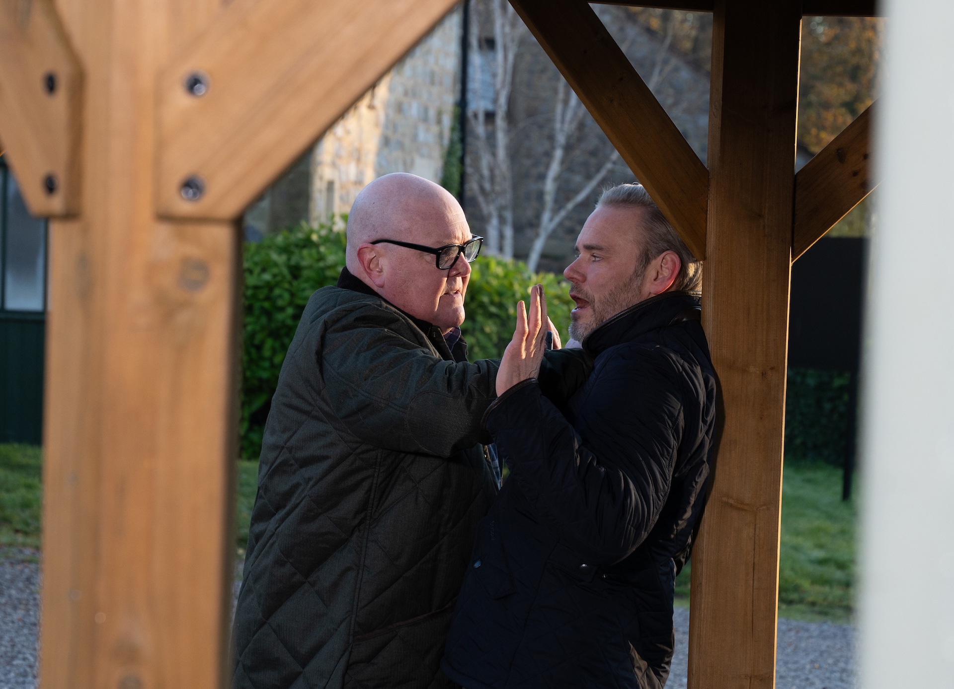 Paddy holds Ray up in Emmerdale