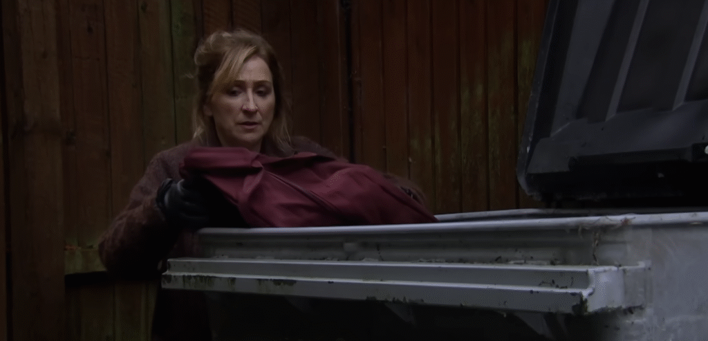 Laurel getting rid of a red bag in Emmerdale