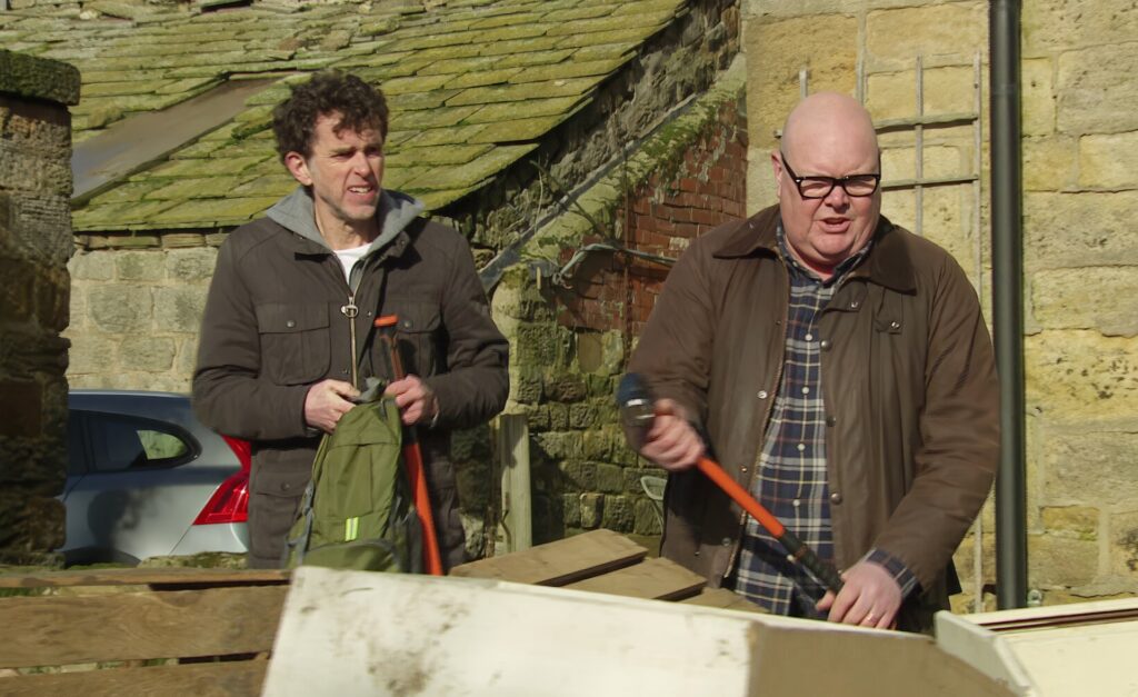Marlon and Paddy take sledgehammers to Celia's farm (Credit: ITV)