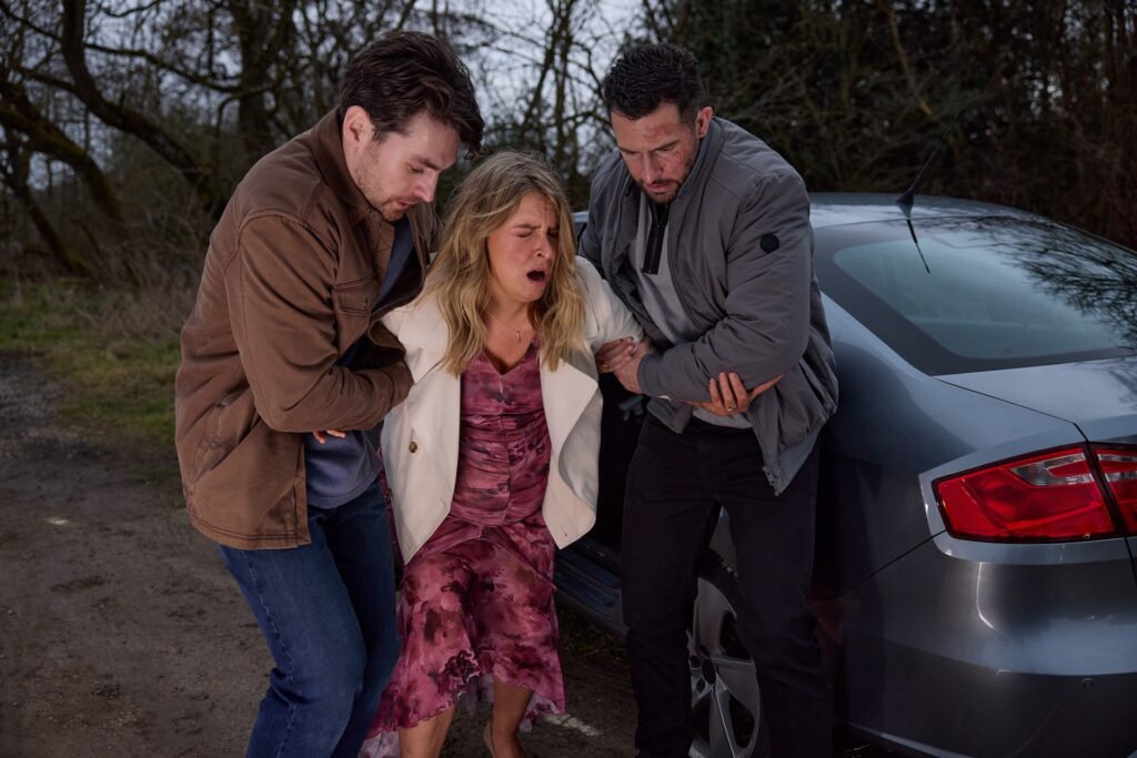 Ross drives by and is forced to help get Charity to hospital (Credit: ITV)